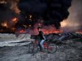 Претенденты на фото года по версии The Guardian: Трамп, беженцы и битва за Мосул