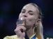 Перша медаль України на Іграх-2024 в Парижі: яскраві фото Харлан з олімпійського п'єдесталу