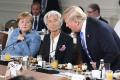 Трамп на саммите G7 бросил в сторону Меркель конфеты 