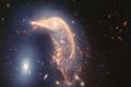 NASA показало цікаве зіткнення пари галактик у формі пінгвіна та яйця