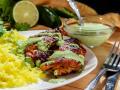 Смажені курячі стегна по-перуанськи у зеленому соусі: оригінальний рецепт