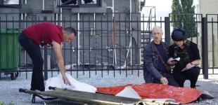 Батько 2 години читав молитви над загиблим сином: росіяни вбили 13-річного хлопчика і подружжя в Харкові