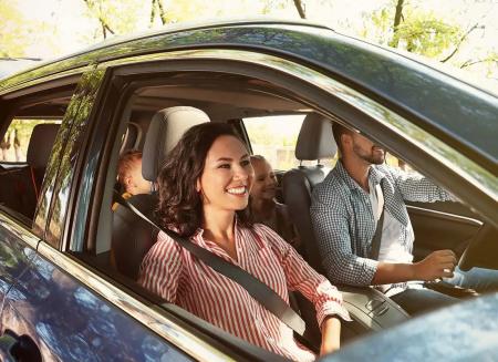 Auto-Insurance-Family-Driving-to-a-Vacation-Destination-with-Kids-in-the-Back-of-the-Car