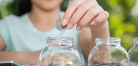 cute-asian-little-girl-playing-with-coins-making-stacks-money-kid-savi_10.06.25_1